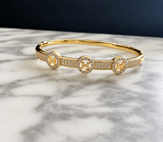 Brazalete Dorado de Microcirconia con Motivos Enmarcados
