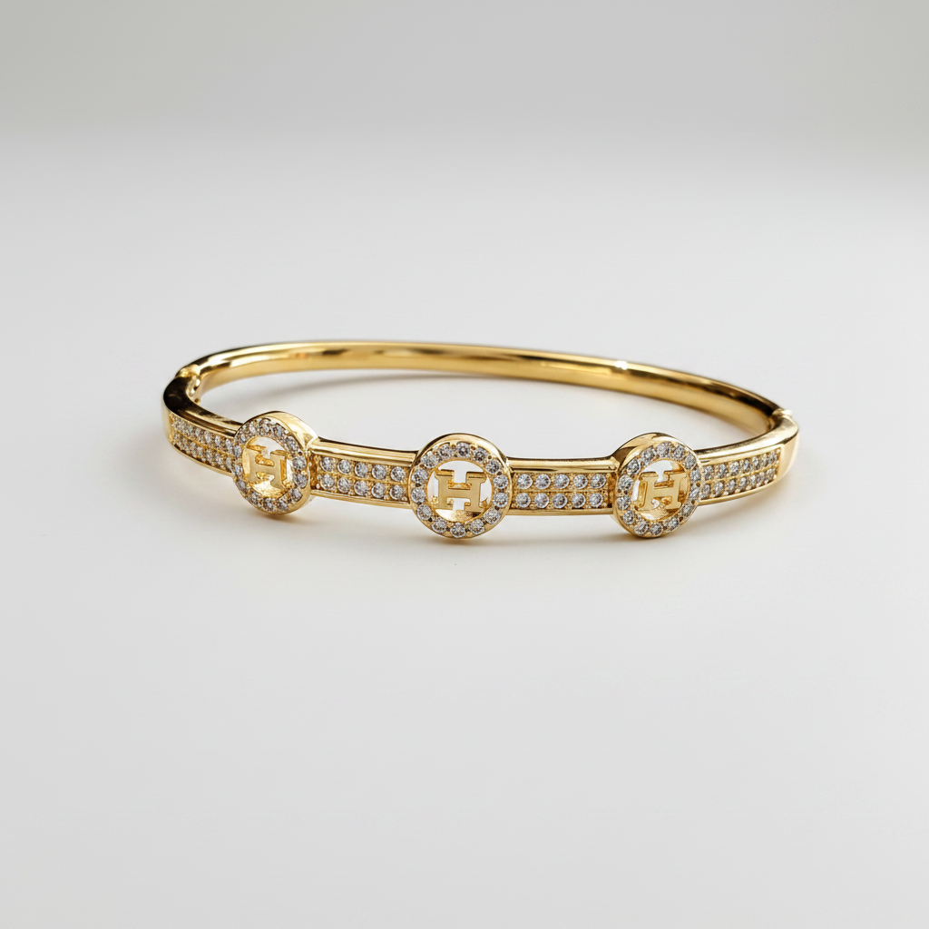 Brazalete Dorado de Microcirconia con Motivos Enmarcados