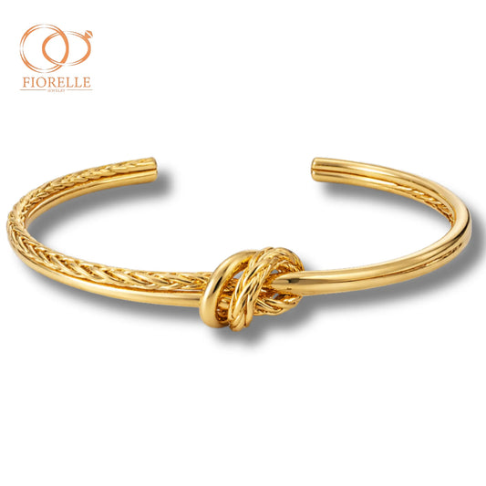 Brazalete Abierto Dorado con Nudo Central y Detalle Trenzado